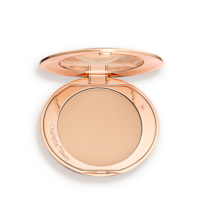 An open, pressed powder compact in a light beige shade. 